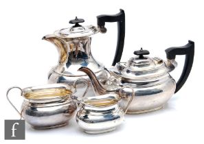 A hallmarked silver four piece boat shaped tea set of plain form, total weight 60oz, pots with