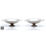 A pair of 1930s Danish Art Deco silver pedestal dishes, the wide shallow bowl raised to a stepped
