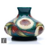 A boxed Moorcroft Pottery Trial vase of compressed form decorated in the Albany pattern designed