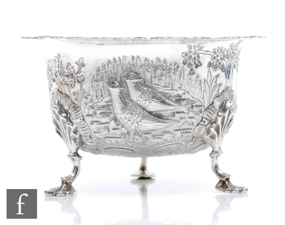 A late Victorian sugar bowl decorated with embossed and engraved scene of two pheasants in a