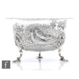 A late Victorian sugar bowl decorated with embossed and engraved scene of two pheasants in a