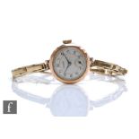 A hallmarked 9ct rose gold lady's Rotary wristwatch, Arabic numerals to a silvered dial and 9ct