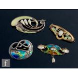 Four Art Nouveau enamelled brooches one 9ct, one gilt metal and two silver examples, one by