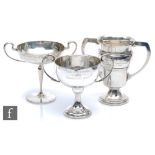 Three hallmarked silver twin handle trophies each with presentation engravings, total weight 34.5oz,