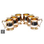 A set of six hallmarked silver half pint tankards of plain baluster form, total weight 31oz, heights