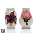 Two miniature Moorcroft vases, the first of barrel form decorated in the Orchid pattern, the