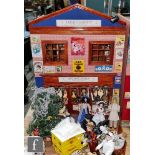 A two storey hinged front dolls house modelled as a shop, the ground floor as Antony Hayes