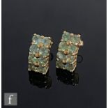 A pair of 9ct hallmarked eight stone alexandrite stud earrings, each comprising two rows of four