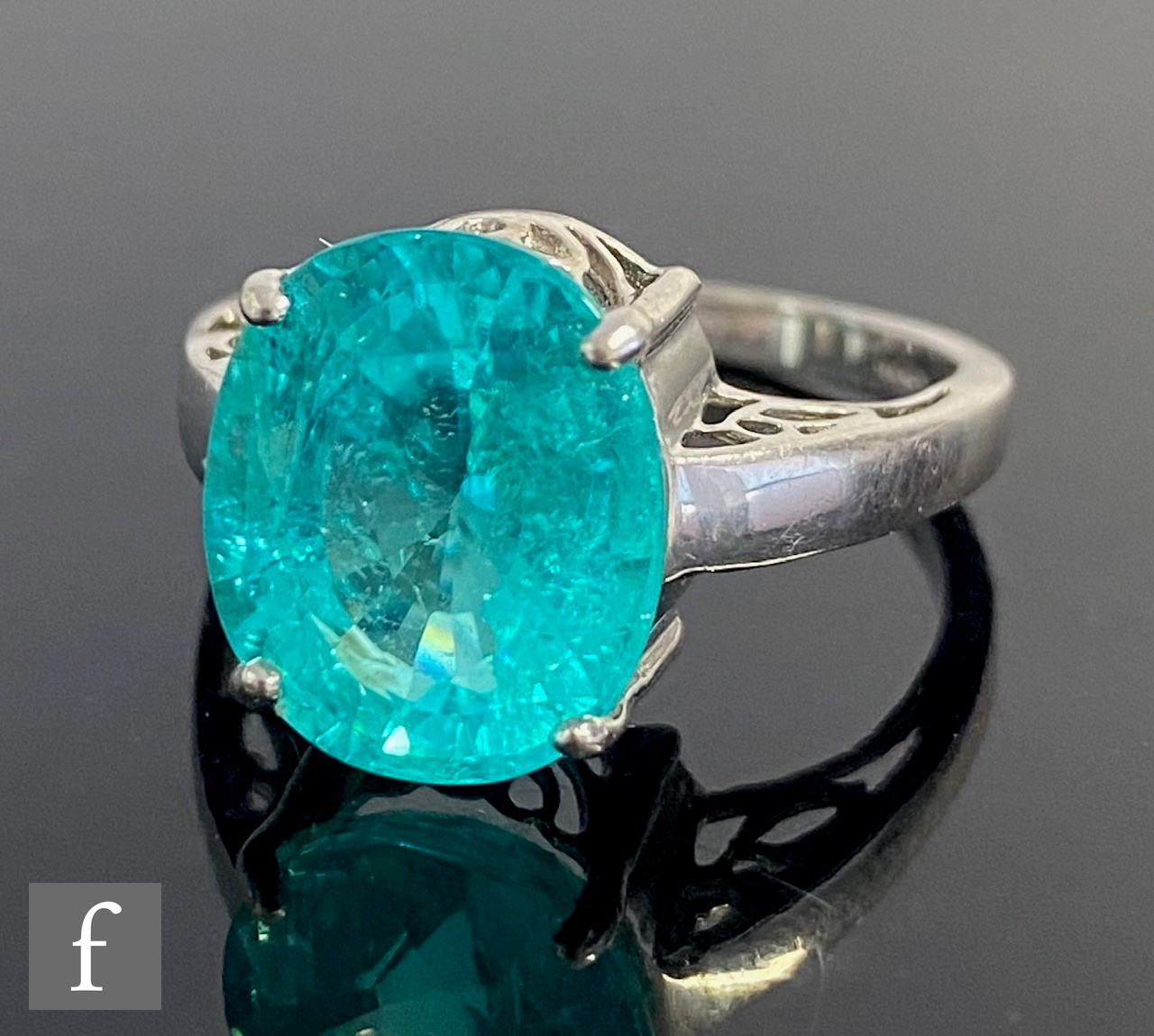 An 18ct white gold single stone, claw set paraiba tourmaline, weight approximately 6.78ct, to