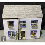 A dolls house modelled as The New House, two storey plus attic, seven rooms, split hinged front