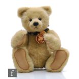 A Charlie Bears CB35730 Edward, blond plush, height 43cm, with swing tags and shipping carton.