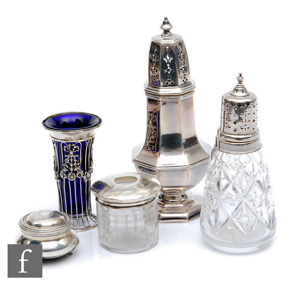Five items of hallmarked silver, two sugar castors, a hair tidy, a small vase and a trinket box,