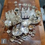 A parcel lot of assorted silver plated items to include a gallery tray, claret jug, cruet stand