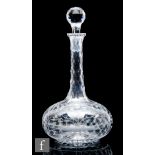 A late 19th Century glass decanter, circa 1870, of compressed globe and shaft form, the diamond