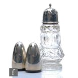 A modern hallmarked silver salt and pepper pot of plain form, heights 7cm, with a silver topped