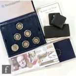 An Elizabeth II Westminster cased set of thirty two fifty pence variants, a Winnie the Pooh