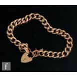 An early 20th Century 9ct rose gold open curb link bracelet, weight 10g, terminating in padlock