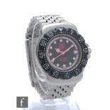 A lady's stainless steel Tag Heuer quartz wristwatch, luminous spots, pink hands and date facility