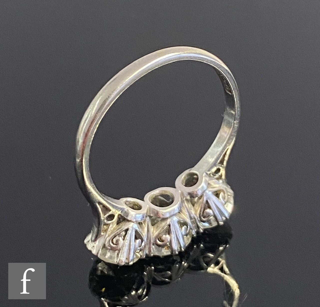 An platinum set diamond three stone ring, brilliant cut claw set stones, total weight - Image 3 of 5