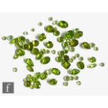 Approximately sixty cut and polished peridot to include faceted pear, oval and round examples,