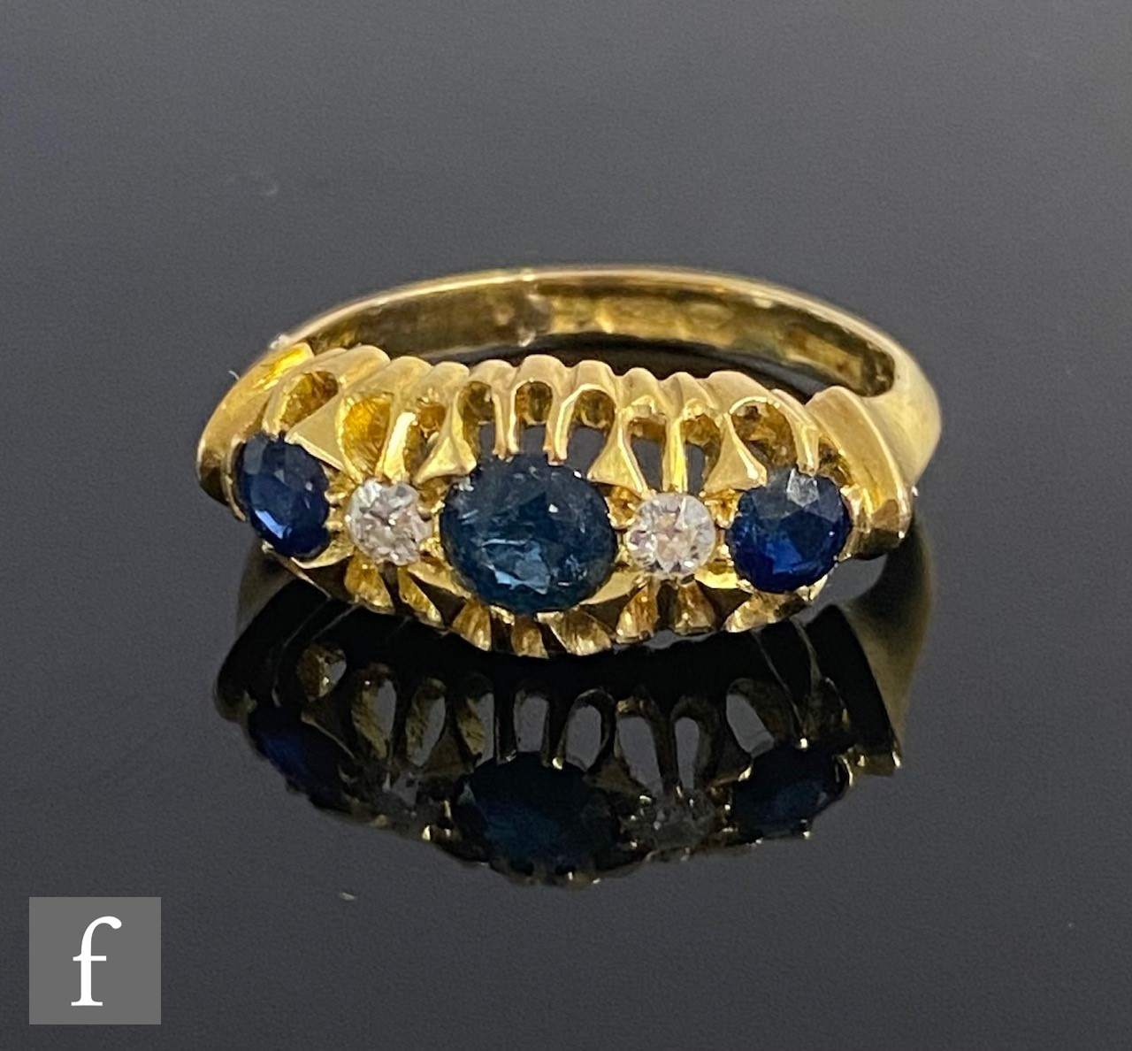 An early 20th Century 18ct hallmarked sapphire and diamond five stone boat shaped ring, weight 3.3g,