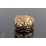 An 18ct diamond three stone ring, raised collar set stones to a domed head, weight 13g, ring size L,
