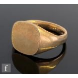 A 9ct hallmarked signet ring of plain form with cushion square head to plain shoulders, weight