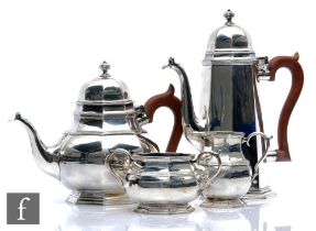 A hallmarked silver four piece tea set of plain octagonal faceted form in the Queen Anne style, pots