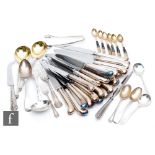 A parcel lot of assorted hallmarked silver flat ware to include a sauce ladle, two serving spoons,