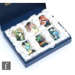 A boxed set of six miniature Moorcroft Pottery vases of varying form patterns comprising Fan, Lily