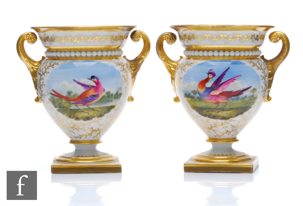 A mirrored pair of 19th Century Flight Barr and Barr Worcester twin handled vases each decorated