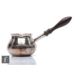 A modern hallmarked silver brandy warmer, plain bowl terminating in turned wooden handle, length