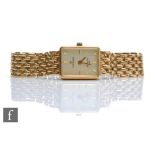 A lady's 9ct hallmarked Sovereign quartz wrist watch, batons to a rectangular champagne dial and