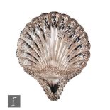 A hallmarked silver shell shaped dish with pierced and embossed decoration, weight 9.5oz, length