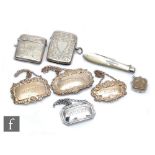 A small parcel lot of hallmarked silver items four assorted decanter labels, two vesta cases, a