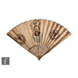 An early 19th Century George III sixteen-stick paper and bone fan decorated in polychrome with a