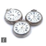 Three hallmarked silver open faced, key wind pocket watches each with Roman numerals to a white