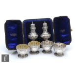 A cased pair of hallmarked silver peppers, with a set of four open salts, total weight 11.5oz,