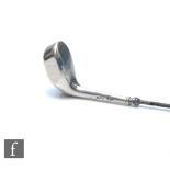 A hallmarked silver hat pin the terminal modelled as a golf club, Chester 1906, Charles Horner.