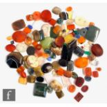 A parcel lot of assorted polished and cut agate stones to include ten intaglio carved, carnelian,