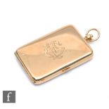 A 9ct hallmarked cushioned rectangular compact opening to reveal mirror and gold covered