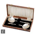 A cased pair of hallmarked silver apostle spoons, total weight 5oz, London 1871, Martin, Hall & Co.