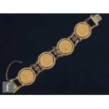 A 9ct hallmarked bracelet detailed with four Elizabeth II claw set full sovereigns, total weight