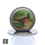 A hallmarked silver circular menu holder enamel decorated with a standing pheasant in a landscape