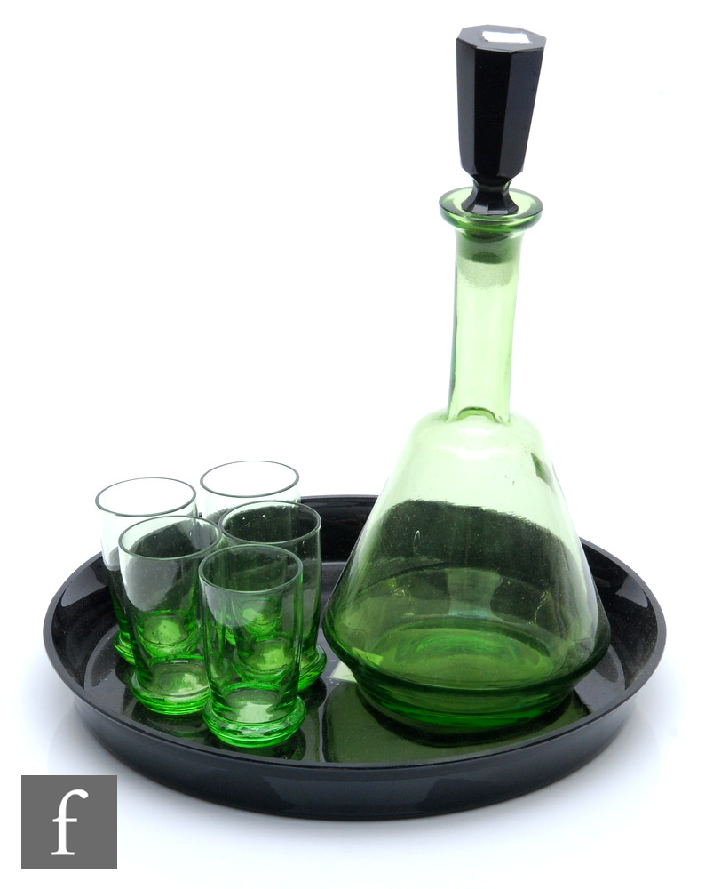 A Czechoslovakian Art Deco liqueur set, circa 1930, with a decanter of conical form with tall collar