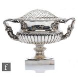 A hallmarked silver pedestal bowl modelled in the manner of The Warwick Vase, square base rising