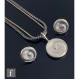 A Danish sterling silver Georg Jensen Whirl pendant designed by Torun Bulow-Hube, of circular