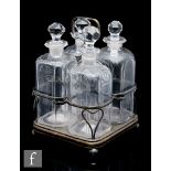 A set of 18th Century glass spirit decanters, circa 1790-95, in a Sheffield plated frame with