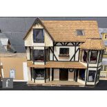 A three storey dolls house built from a Harrison kit and modelled as The Greyhound Pub and