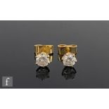 A pair of 18ct single stone diamond stud earrings, brilliant cut, claw set stones each approximately